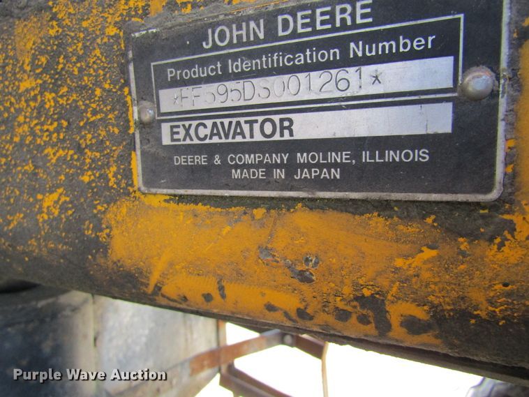 image for item GQ9085 1994 John Deere 595D  rubber tire excavator