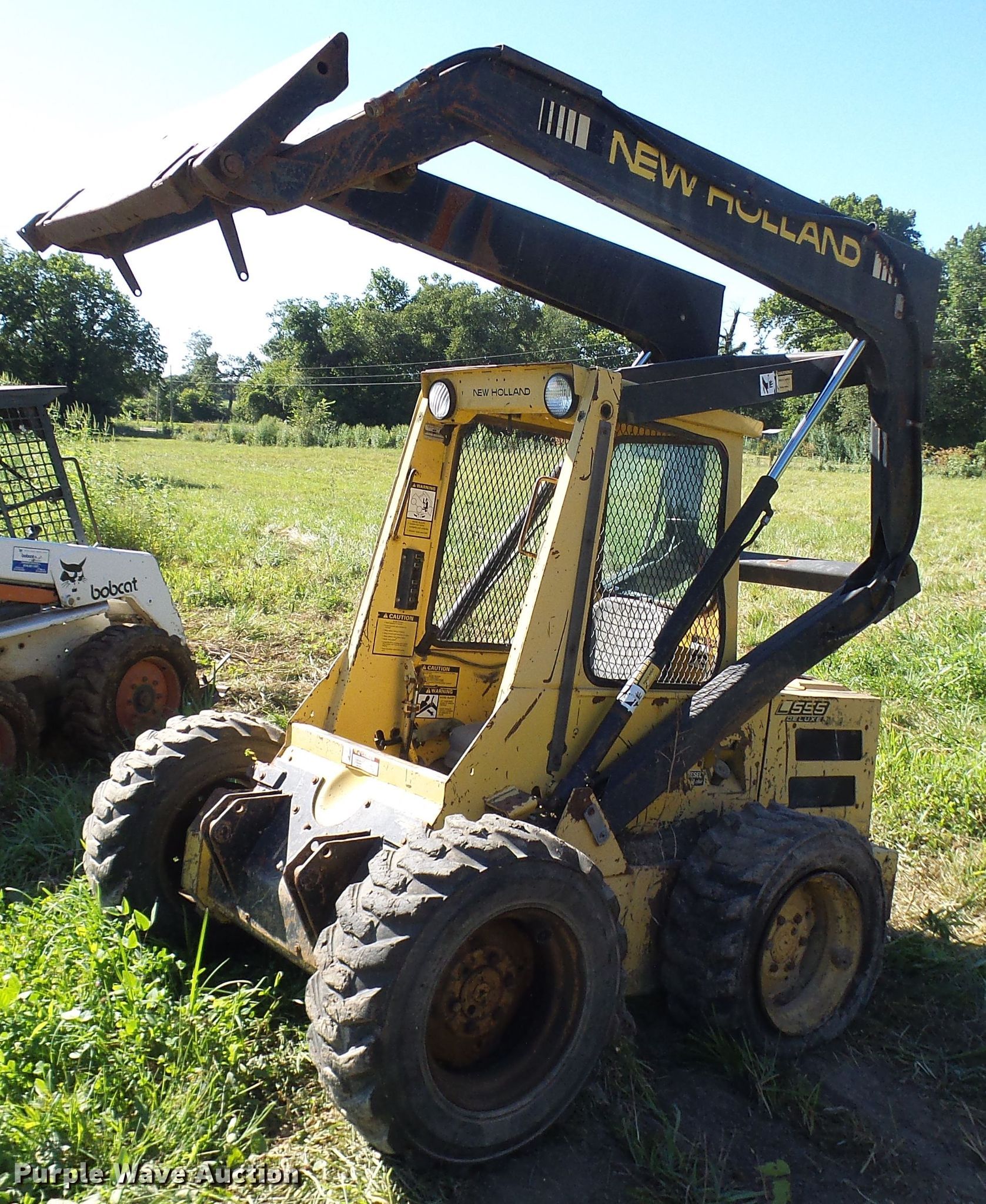 1987 New Holland L555 skid steer loader in Tebbetts, MO Item DG2054