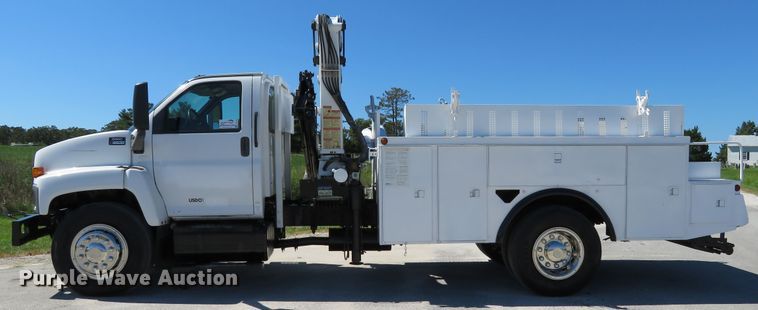image for item DH1149 2006 GMC C8500  flatbed truck with crane