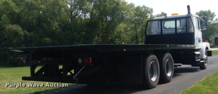 image for item FT9131 1996 Volvo WG  rollback truck