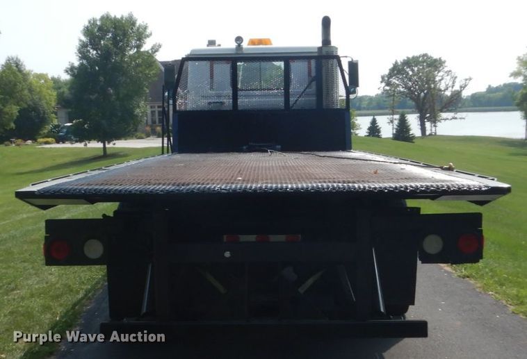 image for item FT9131 1996 Volvo WG  rollback truck