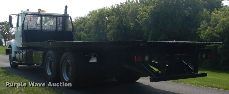 image for item FT9131 1996 Volvo WG  rollback truck