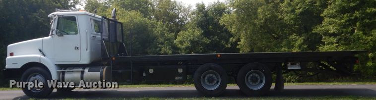 image for item FT9131 1996 Volvo WG  rollback truck