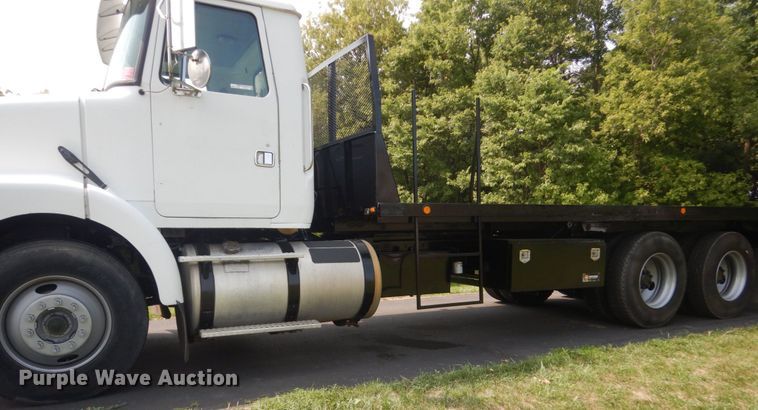 image for item FT9131 1996 Volvo WG  rollback truck