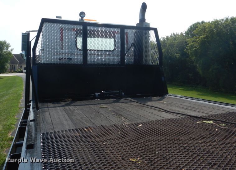 image for item FT9131 1996 Volvo WG  rollback truck