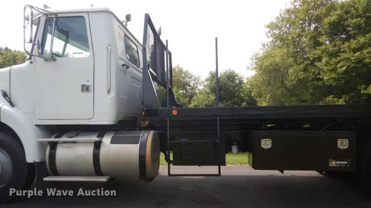 image for item FT9131 1996 Volvo WG  rollback truck