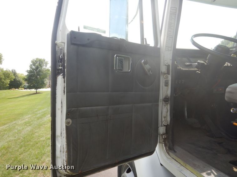 image for item FT9131 1996 Volvo WG  rollback truck