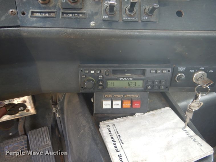 image for item FT9131 1996 Volvo WG  rollback truck