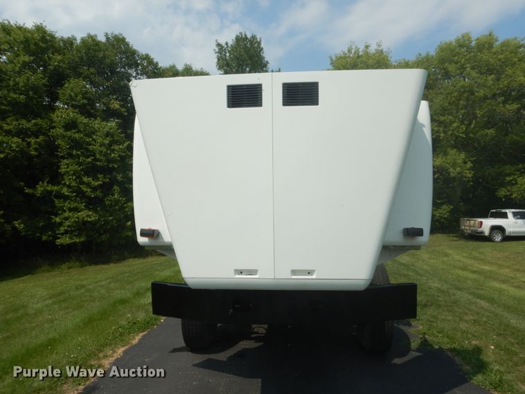 image for item FT9131 1996 Volvo WG  rollback truck