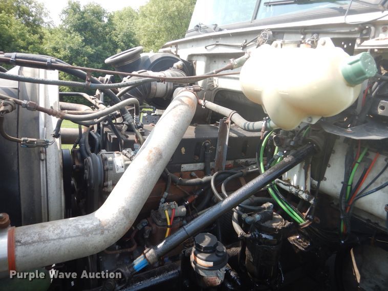 image for item FT9131 1996 Volvo WG  rollback truck