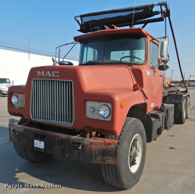 image for item DG1461 1981 Mack DM6855  roll off container truck