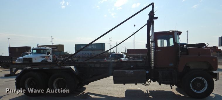 image for item DG1461 1981 Mack DM6855  roll off container truck