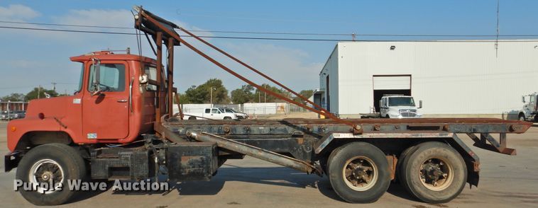 image for item DG1461 1981 Mack DM6855  roll off container truck