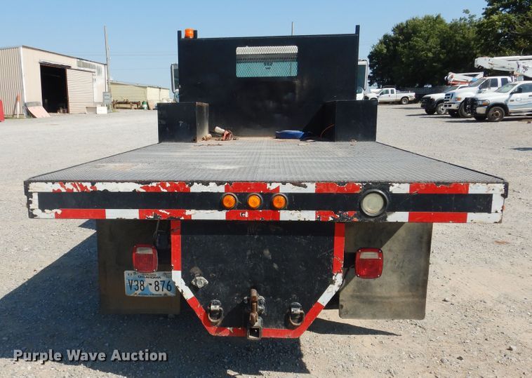image for item DG1469 1999 International 4700  flatbed truck