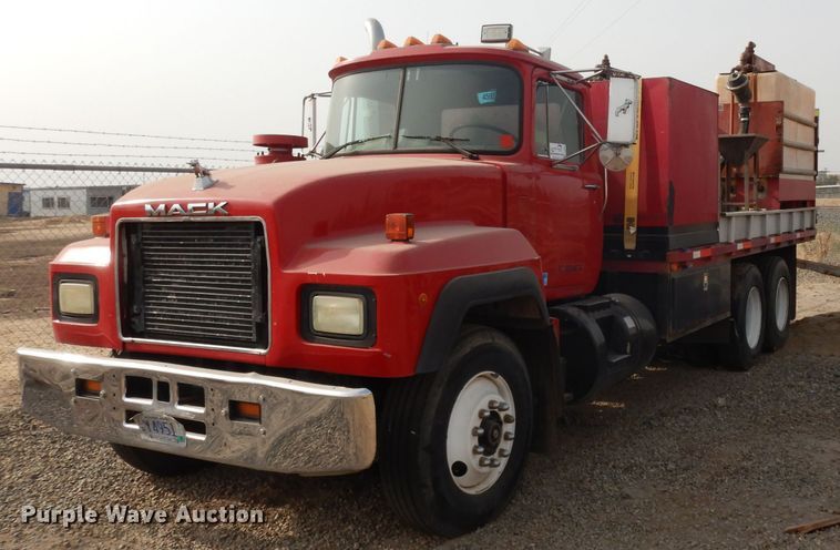 image for item DJ6505 1993 Mack RD688S  flatbed truck with fluid mixing system