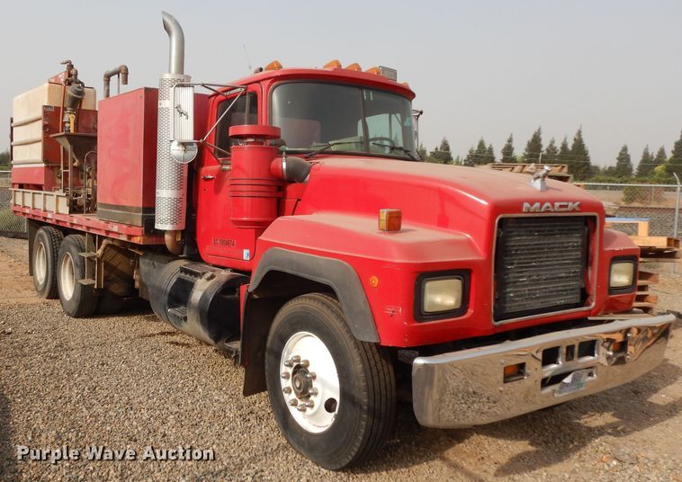 image for item DJ6505 1993 Mack RD688S  flatbed truck with fluid mixing system