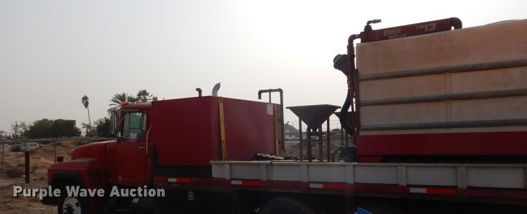 image for item DJ6505 1993 Mack RD688S  flatbed truck with fluid mixing system