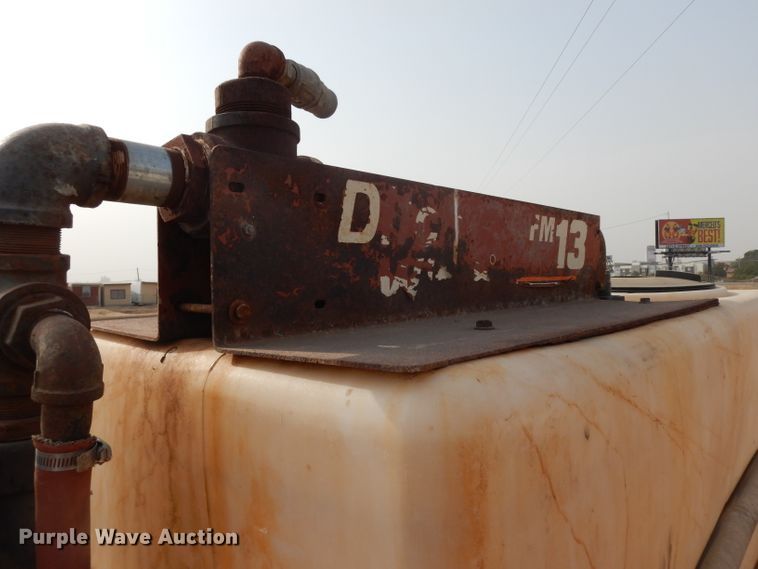 image for item DJ6505 1993 Mack RD688S  flatbed truck with fluid mixing system