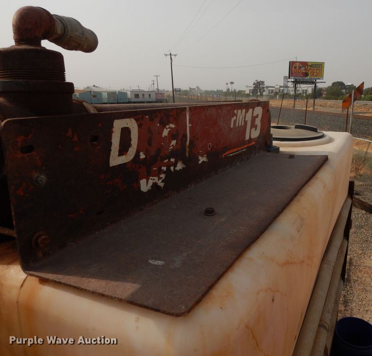 image for item DJ6505 1993 Mack RD688S  flatbed truck with fluid mixing system