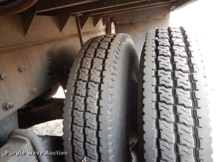 image for item DJ6505 1993 Mack RD688S  flatbed truck with fluid mixing system