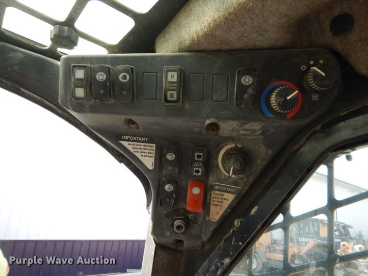 image for item HP9809 2012 John Deere 323D  tracked skid steer loader