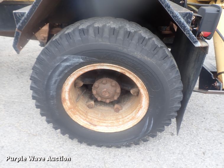 image for item DE0797 1995 Ford F800  truck with Vermeer tree spade