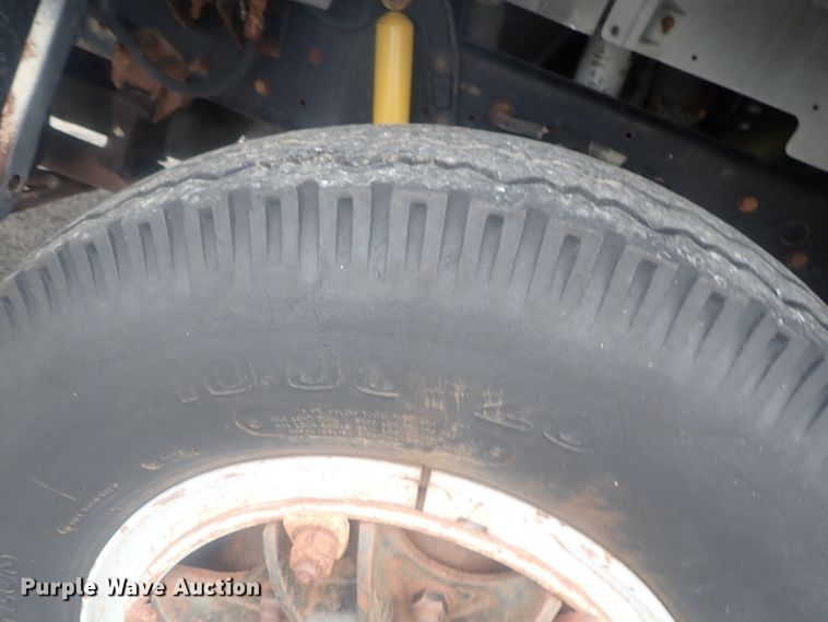 image for item DE0797 1995 Ford F800  truck with Vermeer tree spade