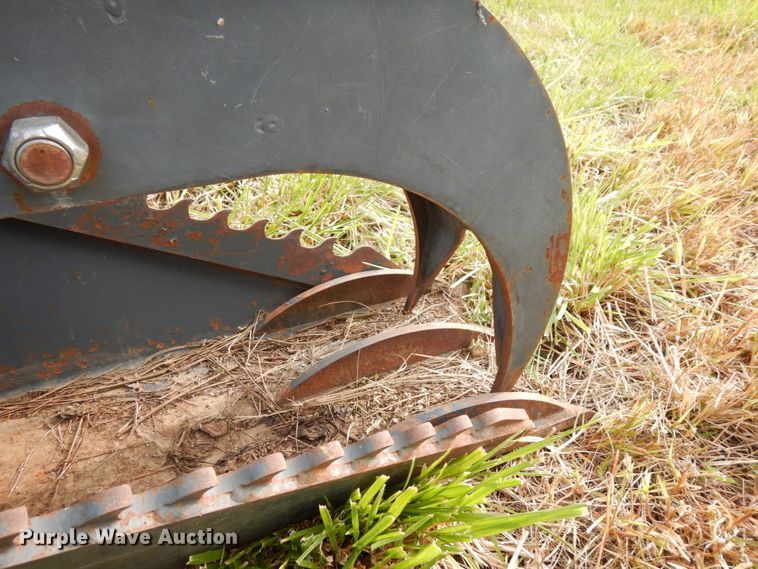 image for item GQ9769 Grotrian Enterprises skid steer root grapple bucket