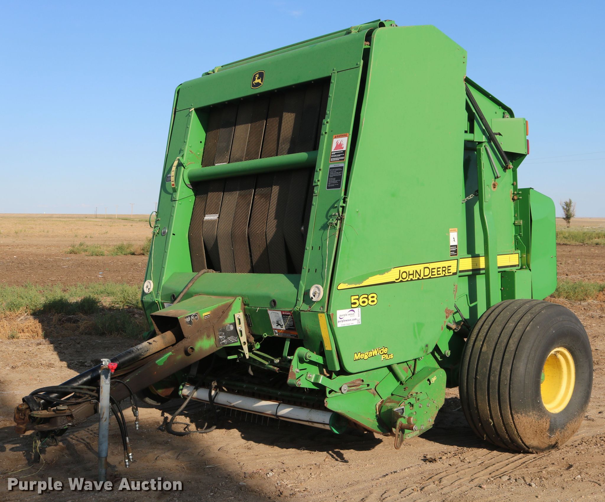John Deere 568 Mega Wide Plus round baler in Brandon, CO | Item