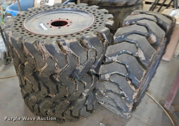 image for item HU9563 (4) 36x12-20 solid tires and wheels