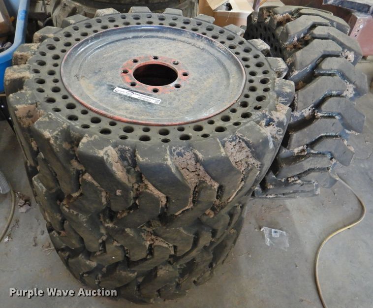 image for item HU9563 (4) 36x12-20 solid tires and wheels