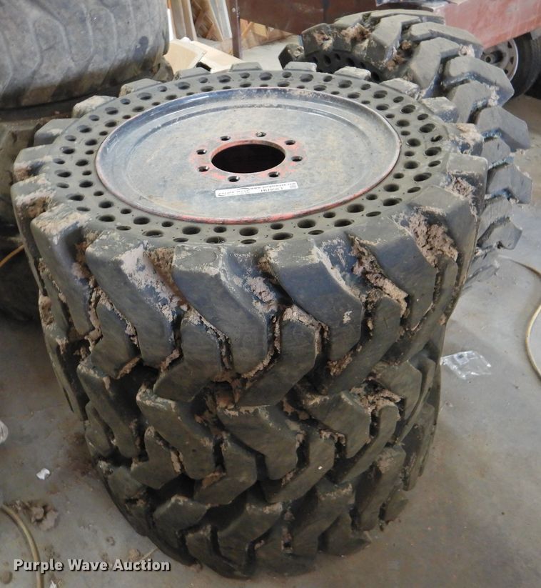 image for item HU9563 (4) 36x12-20 solid tires and wheels