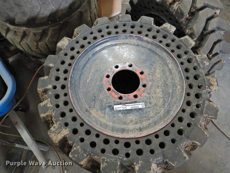 image for item HU9563 (4) 36x12-20 solid tires and wheels