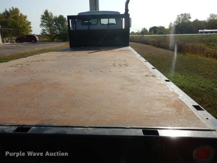 image for item HN9359 2002 Sterling L-Line  flatbed truck