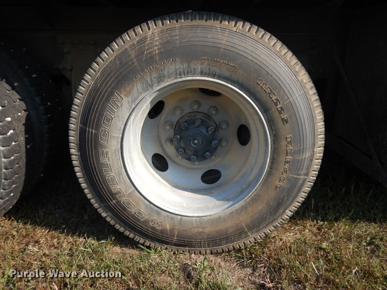 image for item HN9359 2002 Sterling L-Line  flatbed truck