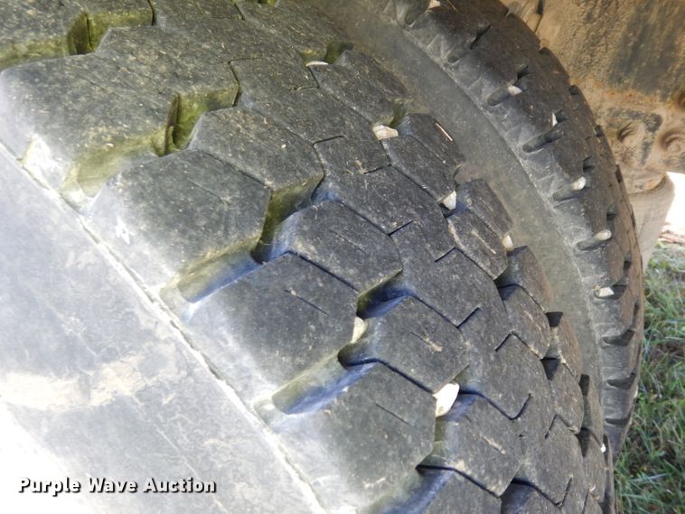 image for item HN9359 2002 Sterling L-Line  flatbed truck