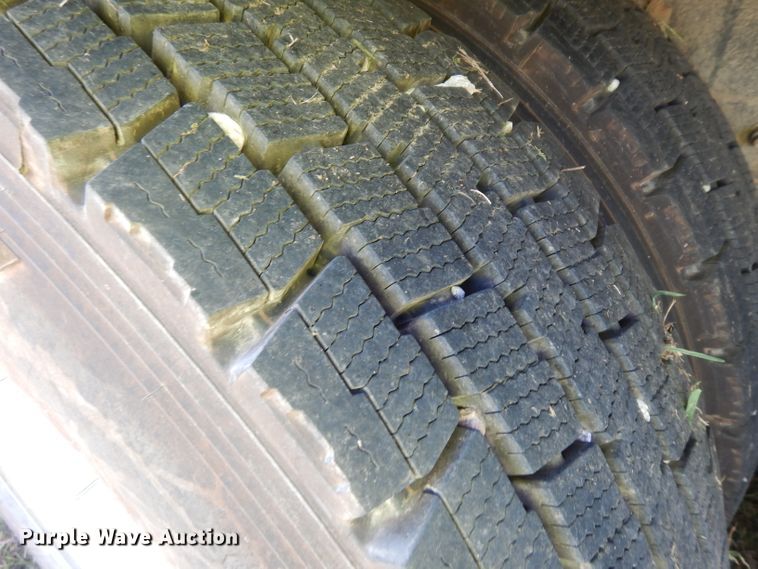 image for item HN9359 2002 Sterling L-Line  flatbed truck