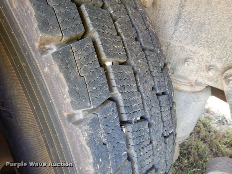 image for item HN9359 2002 Sterling L-Line  flatbed truck