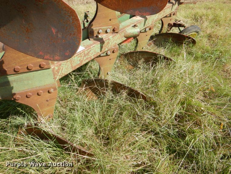 image for item DH5390 John Deere E835A four bottom rollover plow
