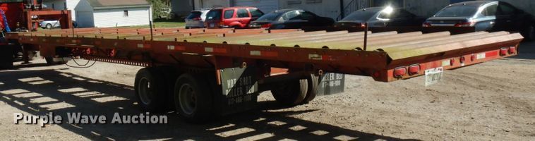 image for item HD9097 2006 Trussmaster roll off tilt deck trailer