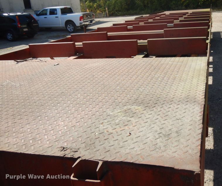 image for item HD9097 2006 Trussmaster roll off tilt deck trailer