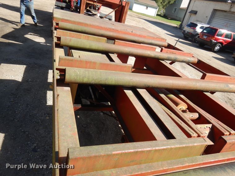 image for item HD9097 2006 Trussmaster roll off tilt deck trailer