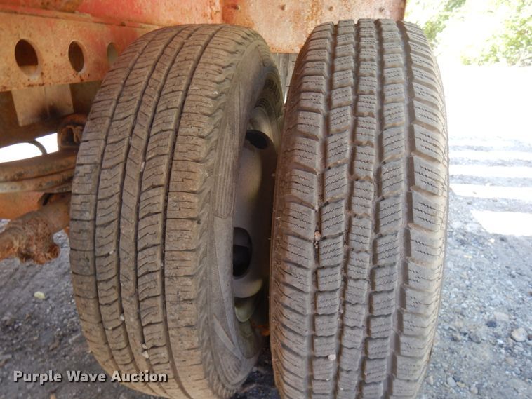 image for item HD9097 2006 Trussmaster roll off tilt deck trailer