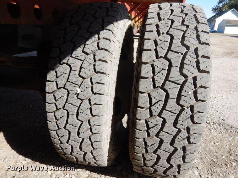 image for item HD9097 2006 Trussmaster roll off tilt deck trailer