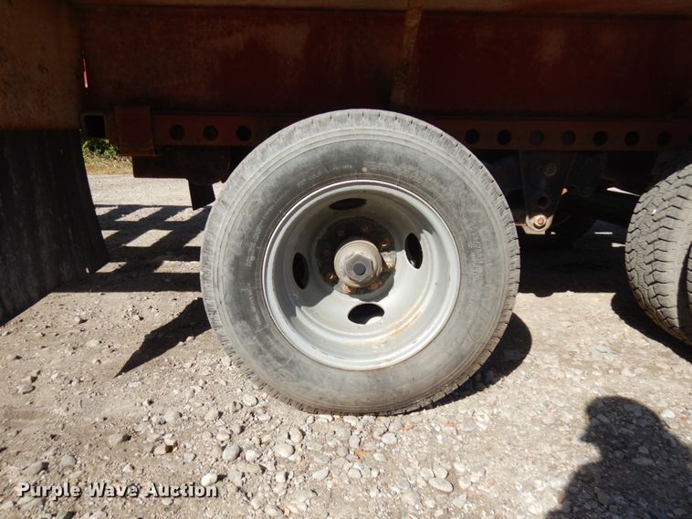 image for item HD9097 2006 Trussmaster roll off tilt deck trailer