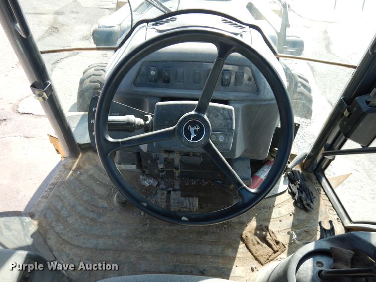 image for item DH7031 2009 John Deere 710J  backhoe