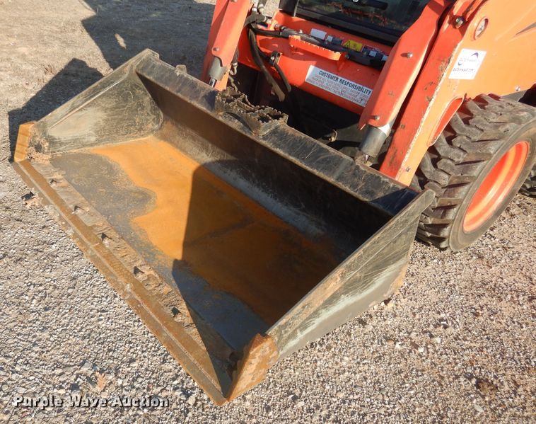 image for item DI3529 2017 Kubota SSV65  skid steer loader