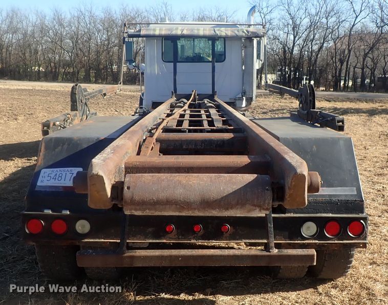 image for item DI7354 2003 Mack CV713  roll-off container truck