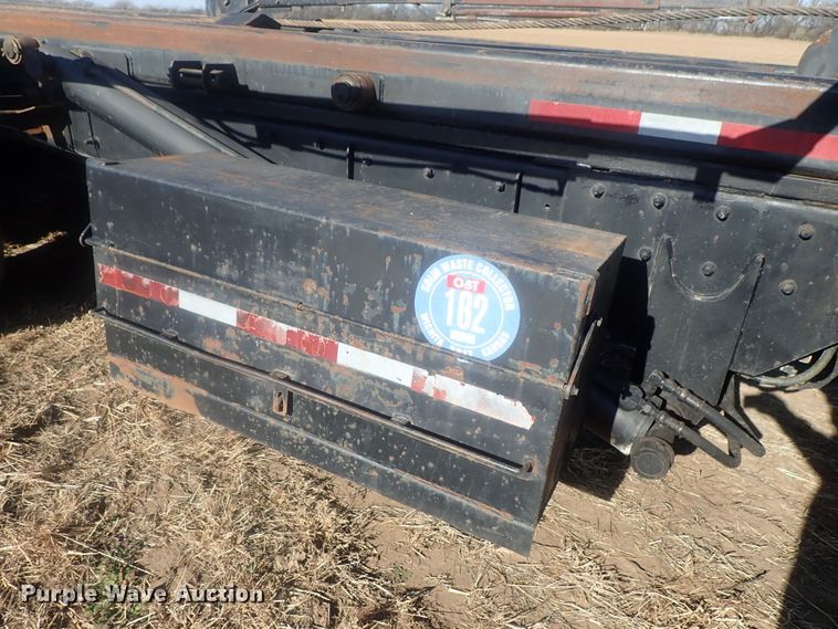 image for item DI7354 2003 Mack CV713  roll-off container truck