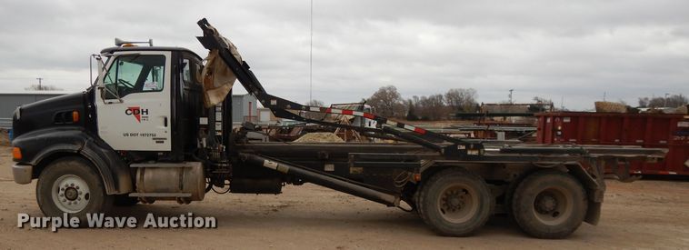 image for item DI8010 1999 Sterling Acterra  roll-off container truck